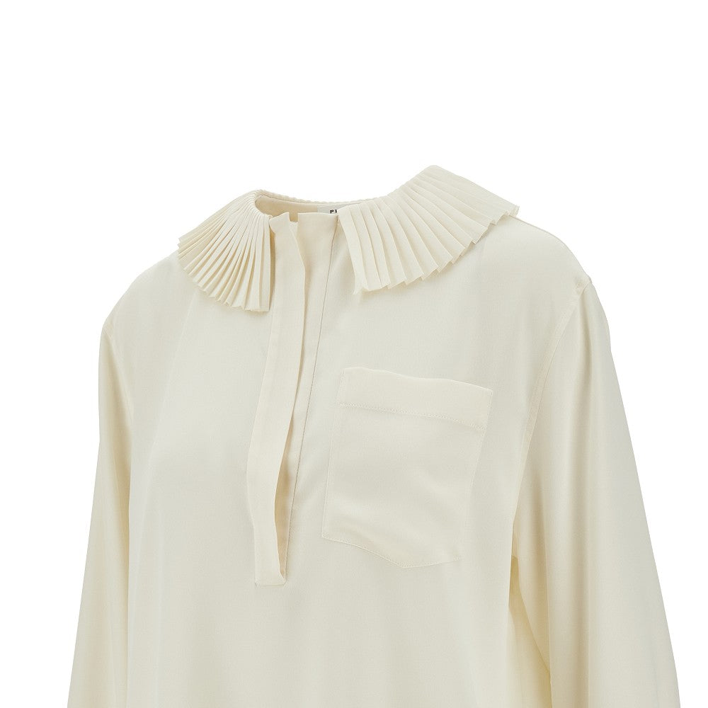 Blusa con dettagli a pieghe
