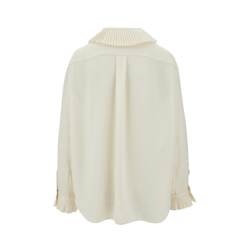 Blusa con dettagli a pieghe