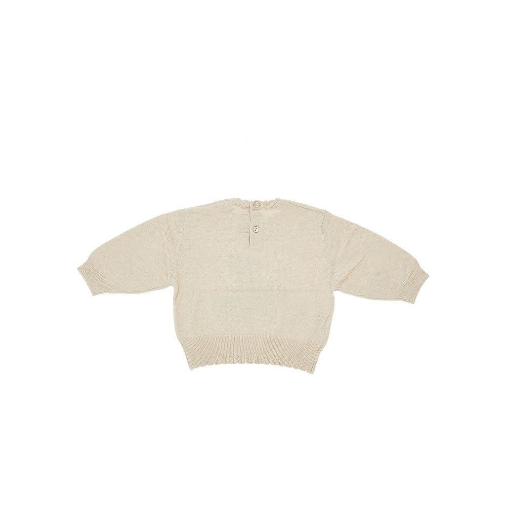 Knitted sweater with scalloped edges