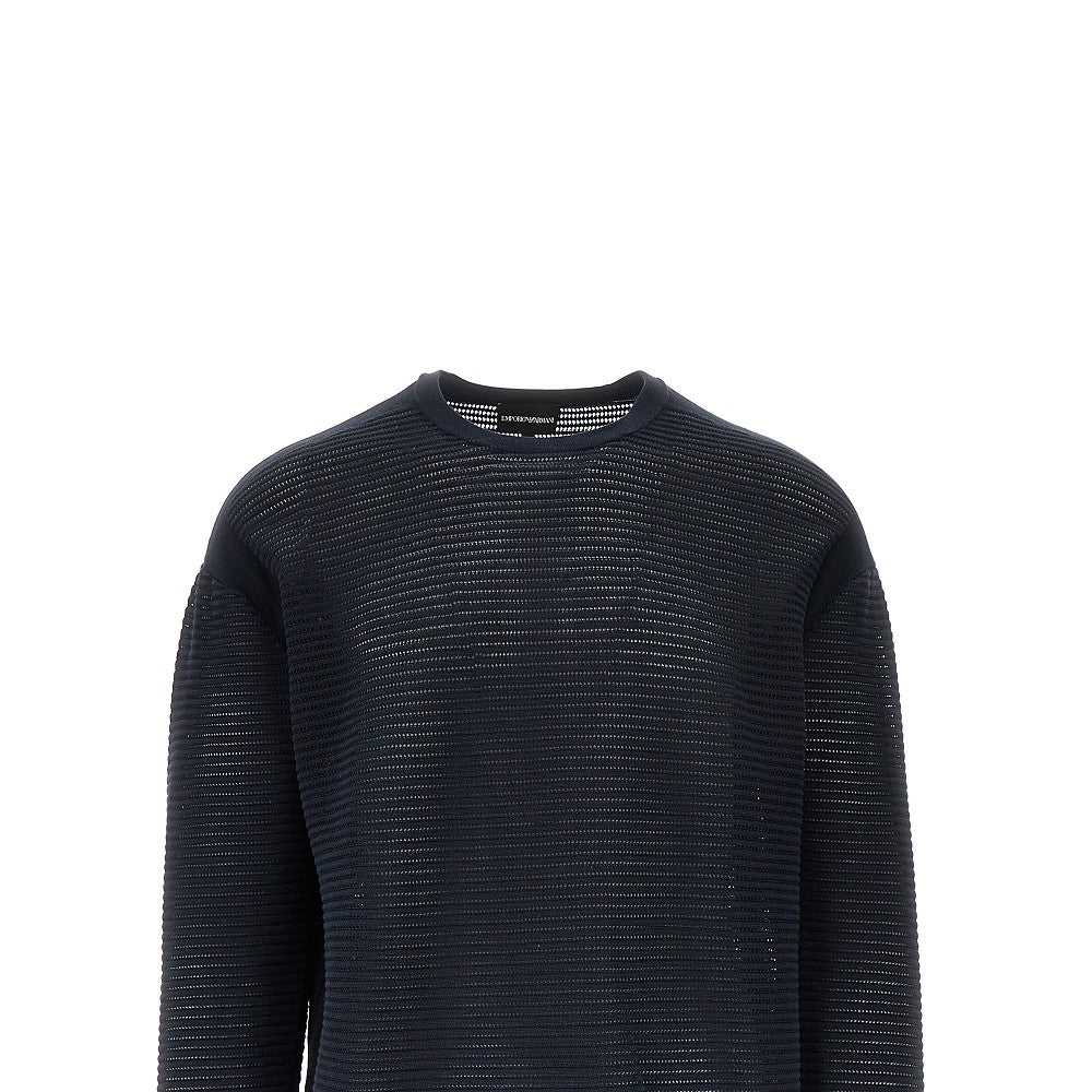 Knitted sweater with openworked motif
