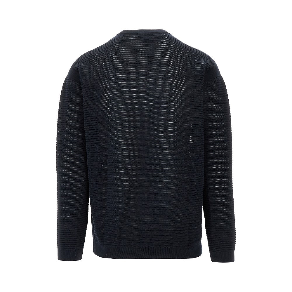 Knitted sweater with openworked motif