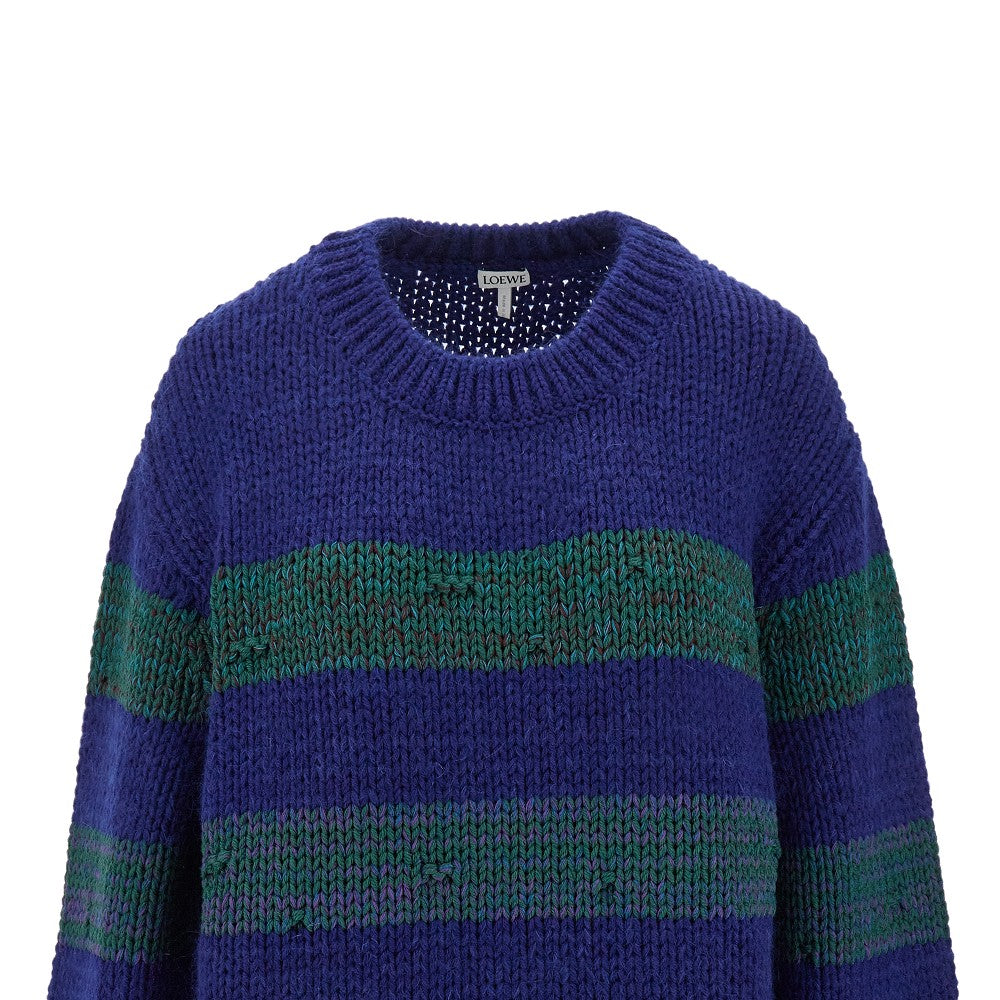 Pullover a righe con effetto smagliato