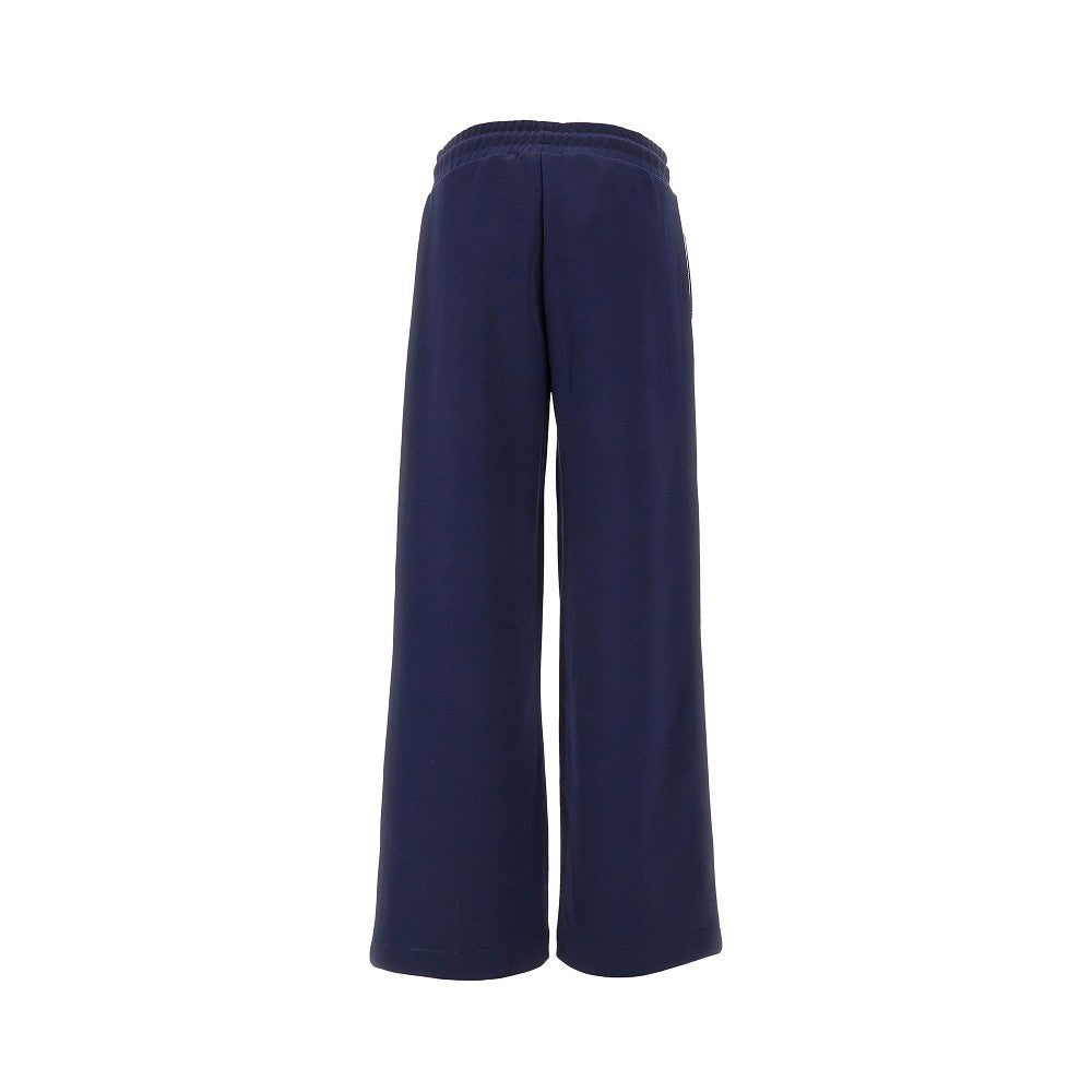 Track pants with openworked inlay