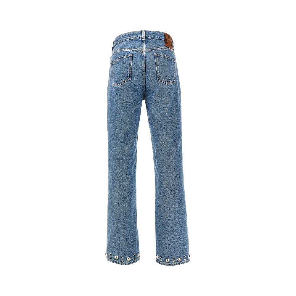 Five-pocket jeans with studs and eyelets