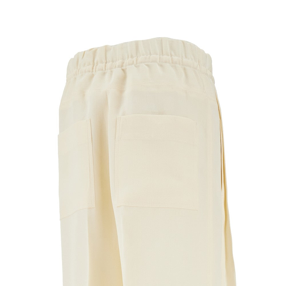 Pantalone in canvas di misto seta con pieghe