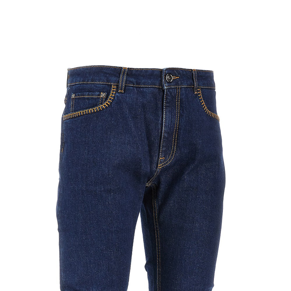 Jeans in denim stretch con impunture