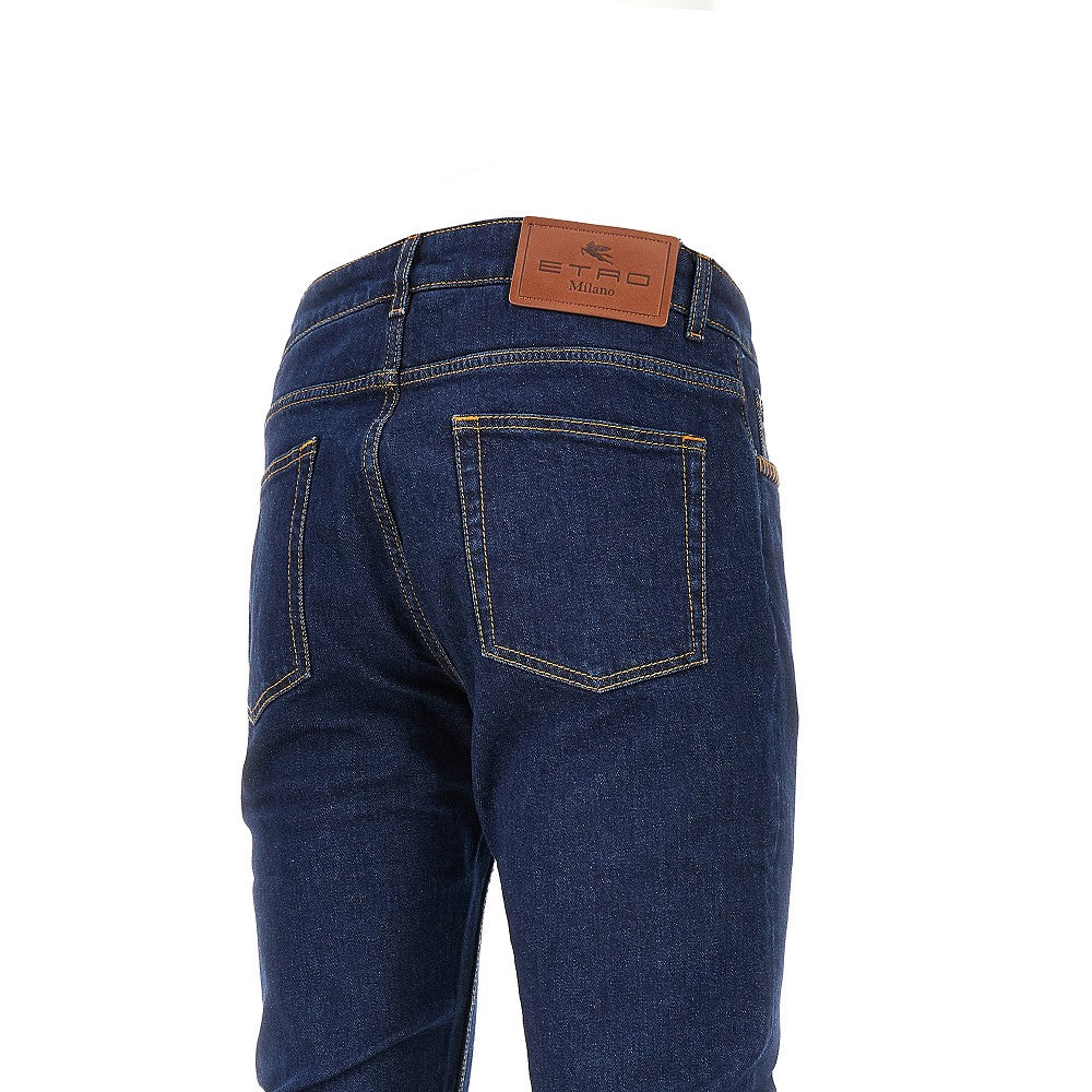 Jeans in denim stretch con impunture