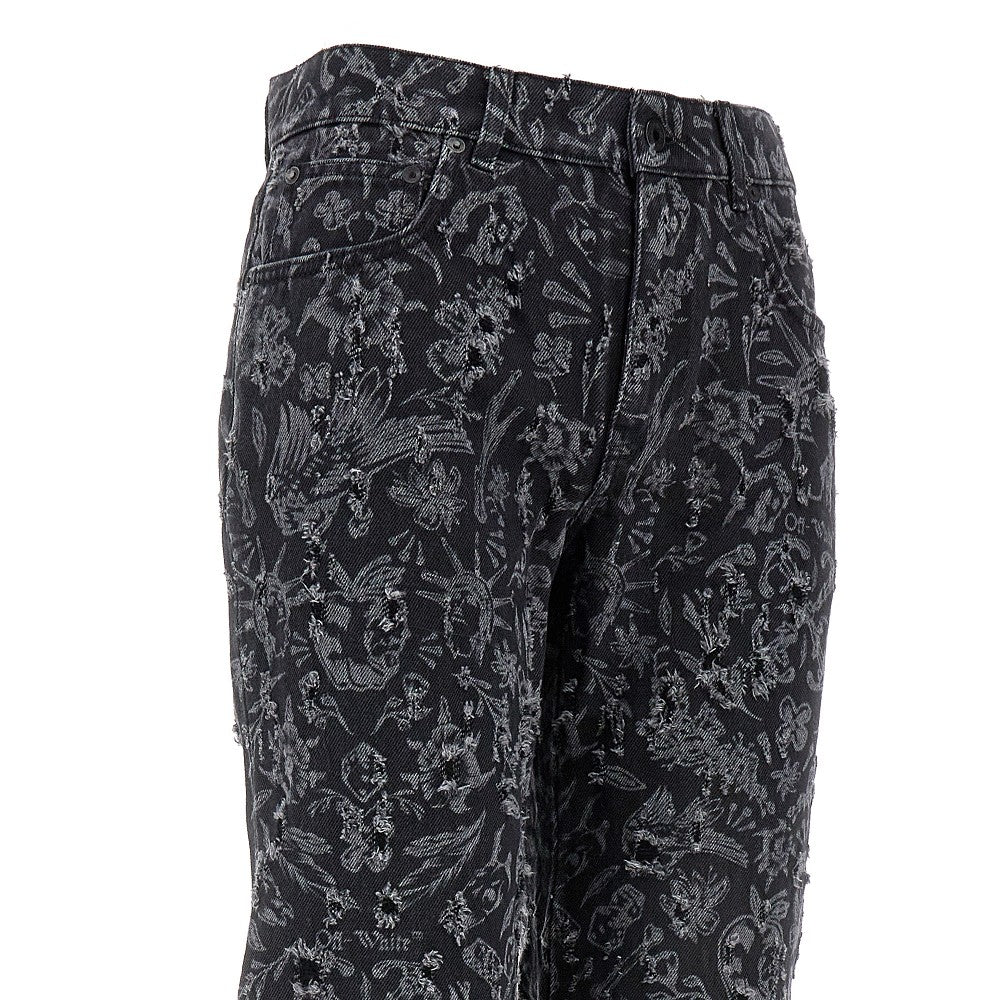 Jeans in denim distressed con motivo Tattoo