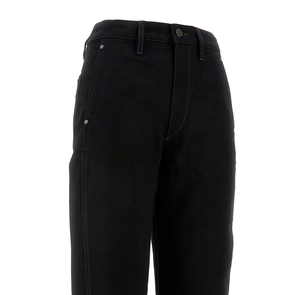 Denim pants with twisted seams
