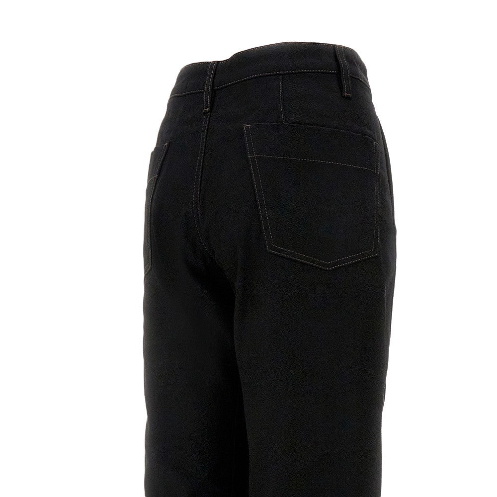 Denim pants with twisted seams