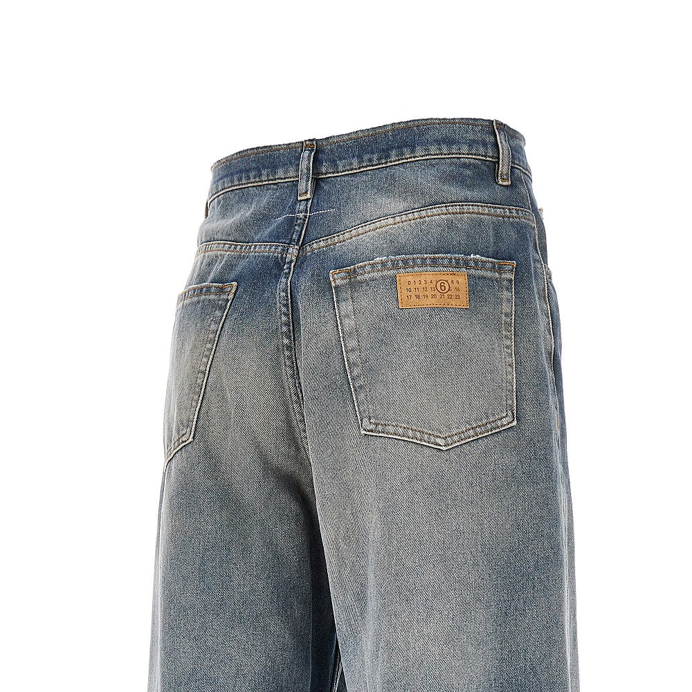 Jeans a gamba ampia con vita a taglio vivo