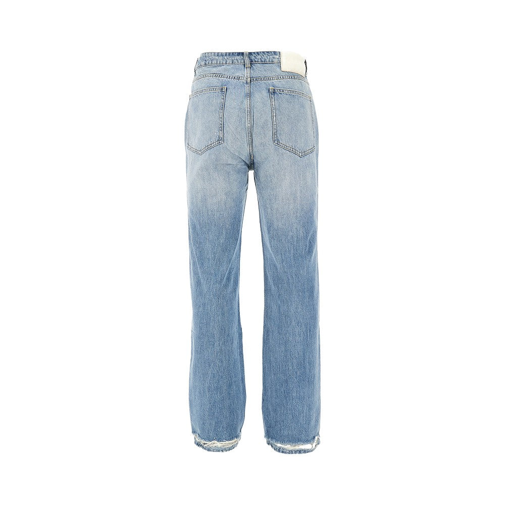 Jeans con strappi riparati