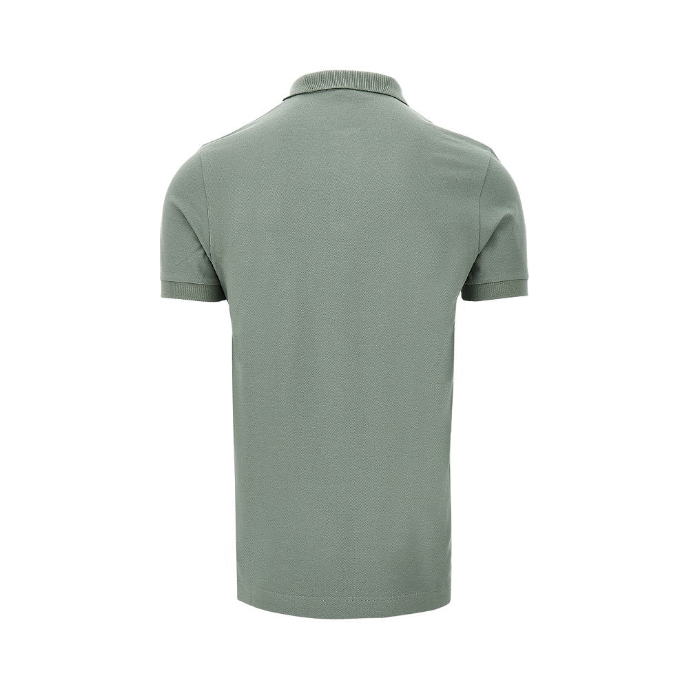 Polo in piquet stretch con patch logo