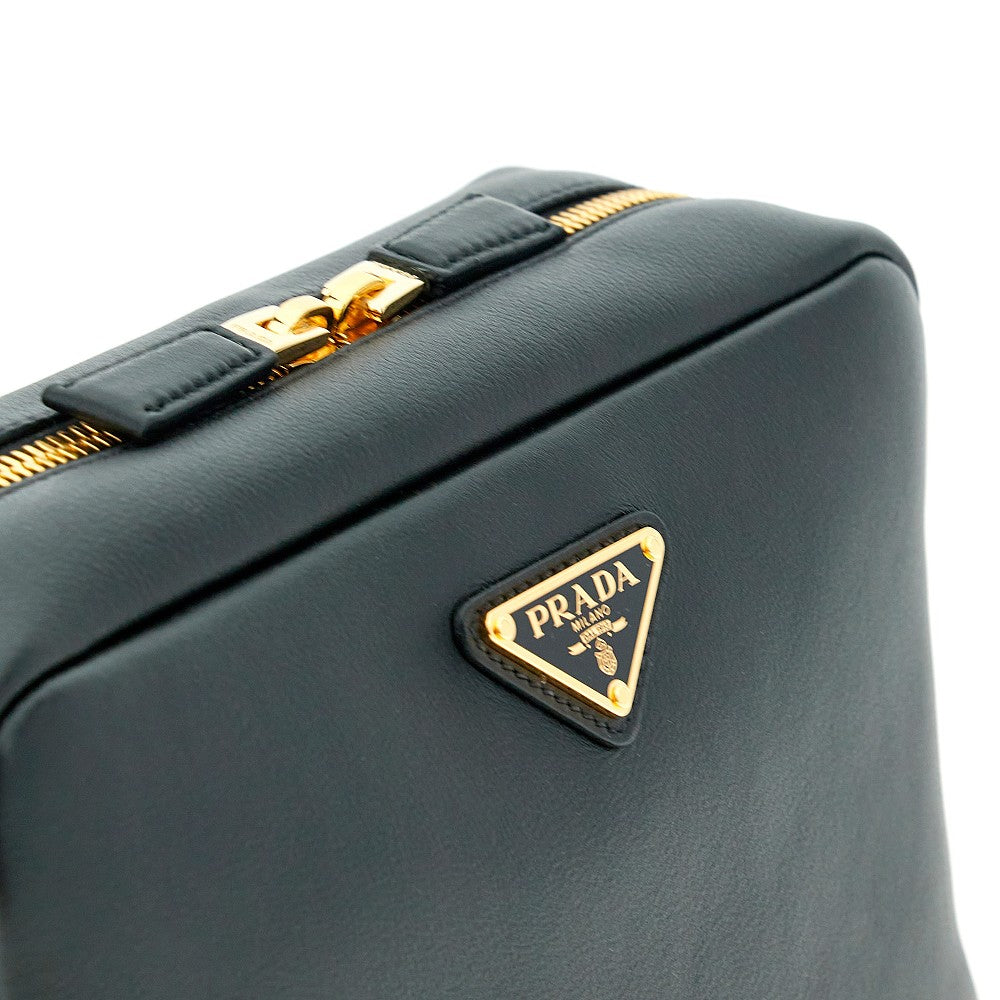 Borsa a tracolla in pelle con logo triangolo