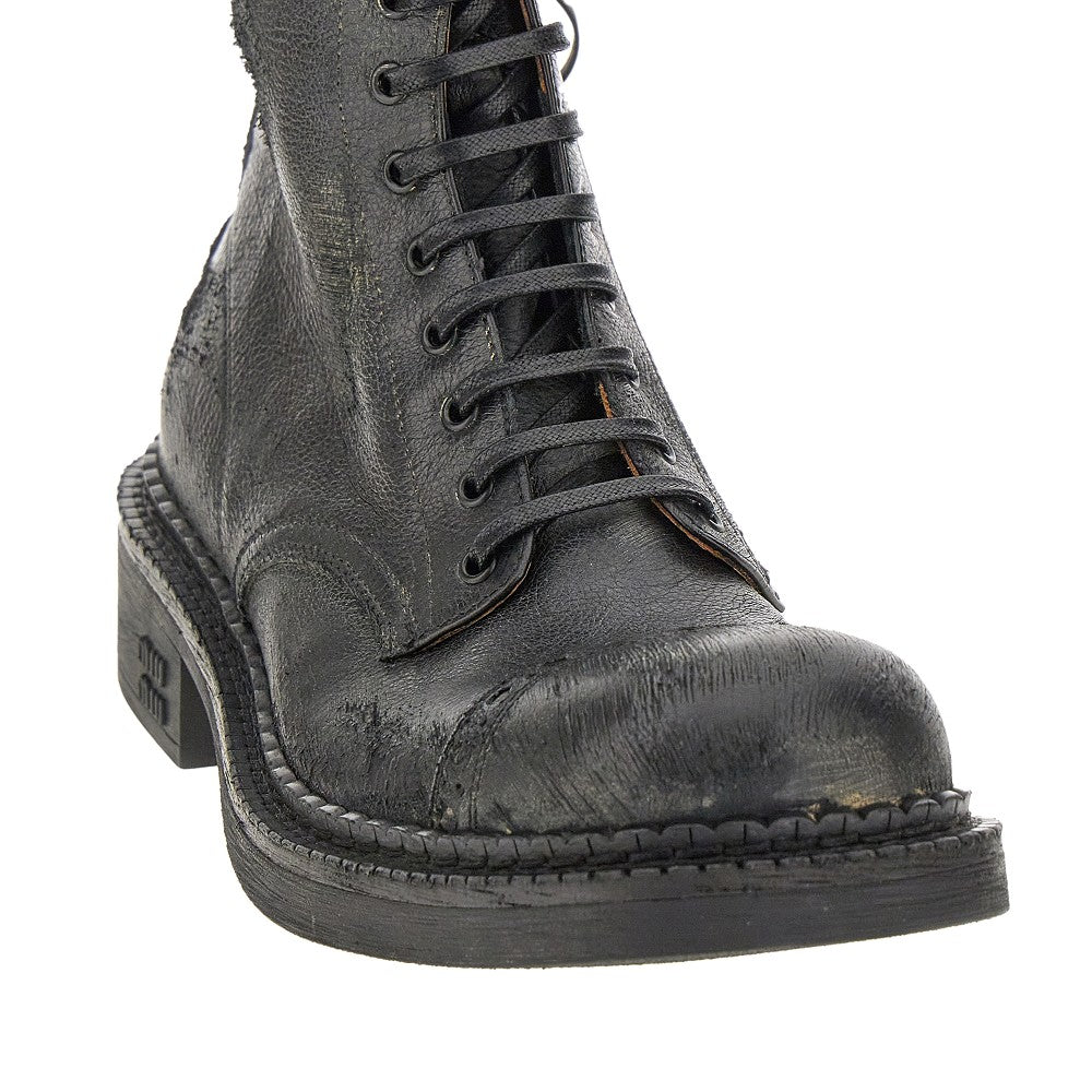Antiquated leather lace-up boots