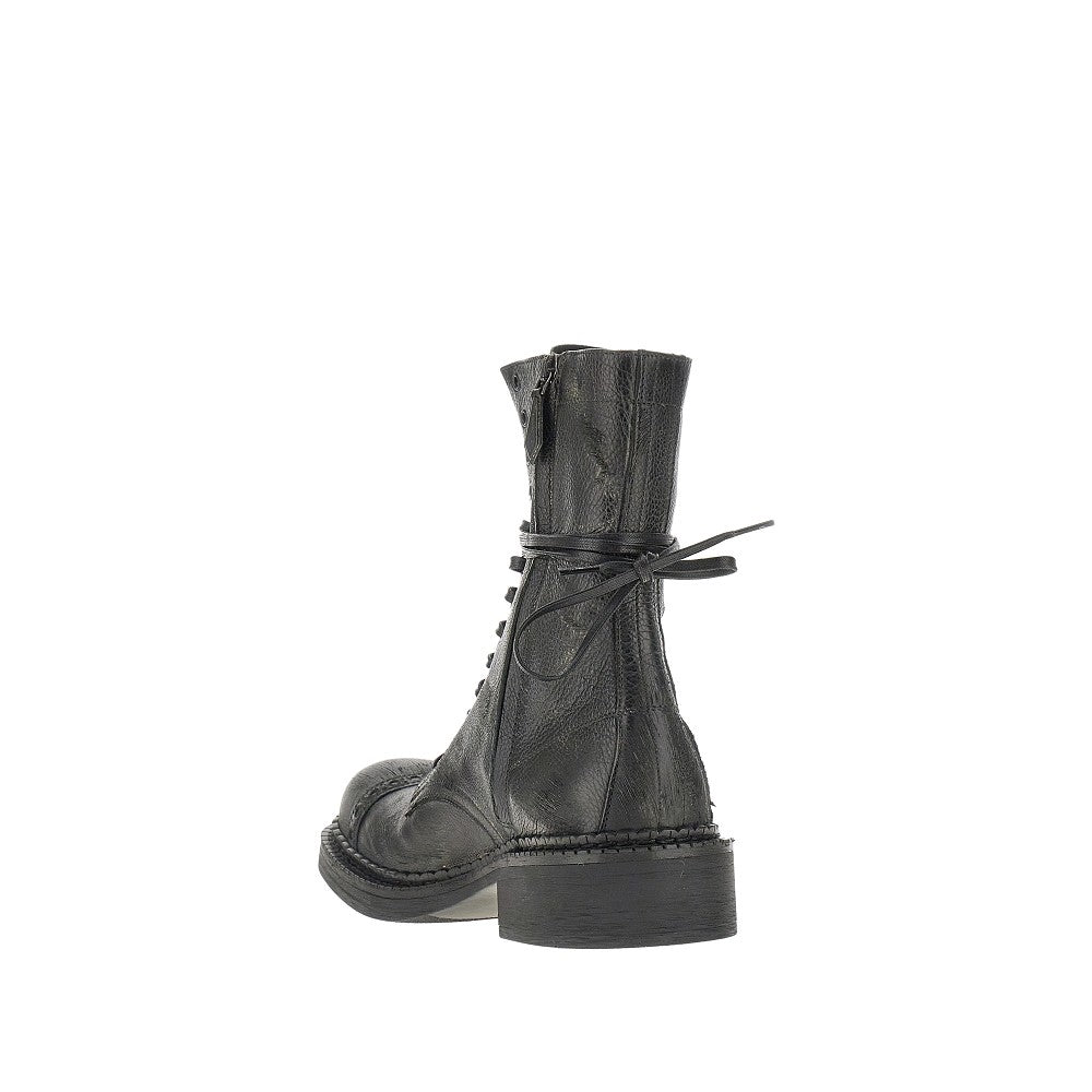 Antiquated leather lace-up boots