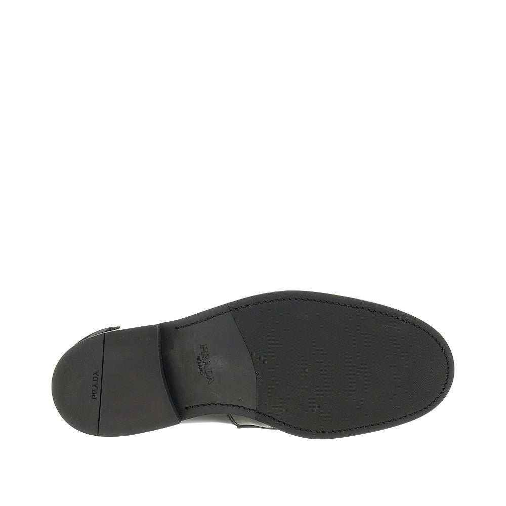 Patent leather loafers with triangle logo