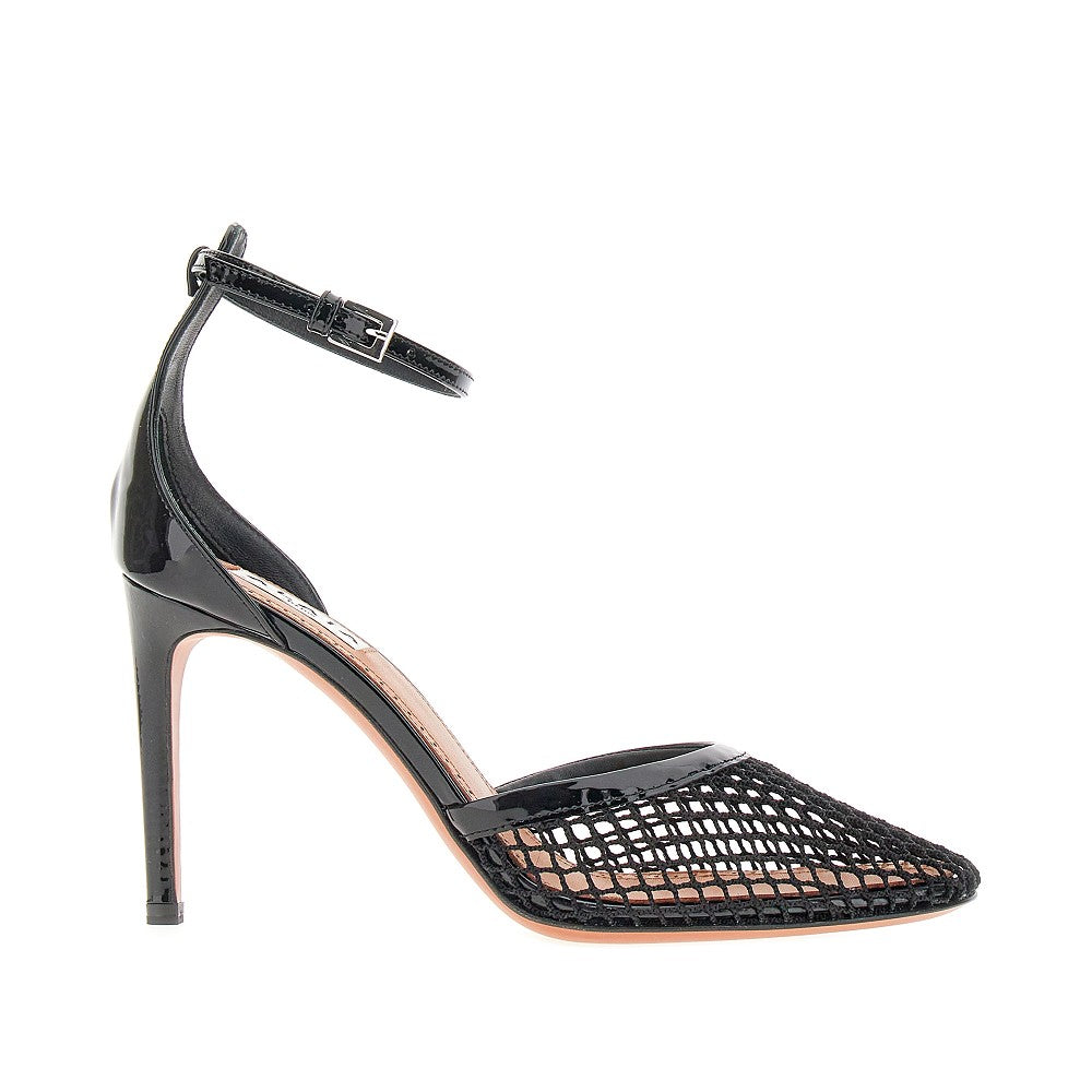 Fishnet and patent leather pumps
