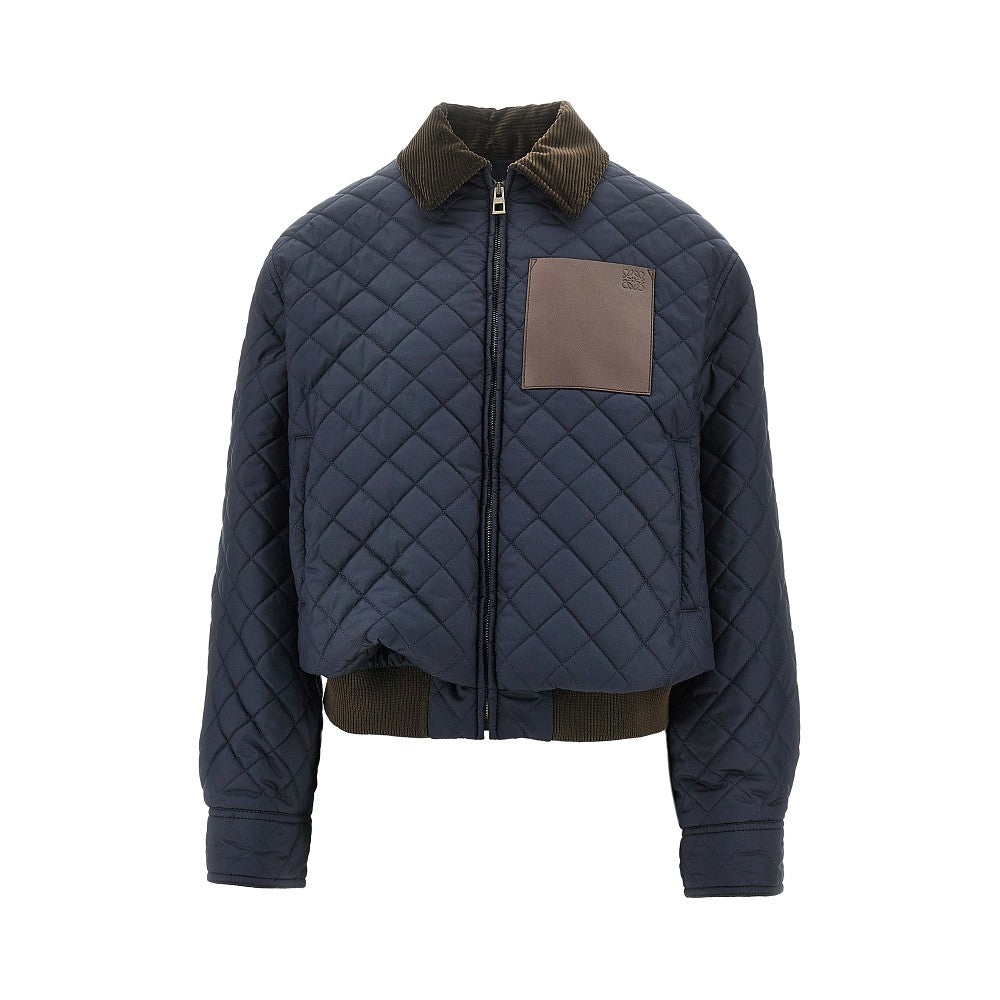 Quilted jacket with leather pocket