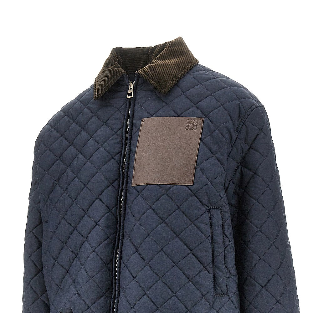 Quilted jacket with leather pocket