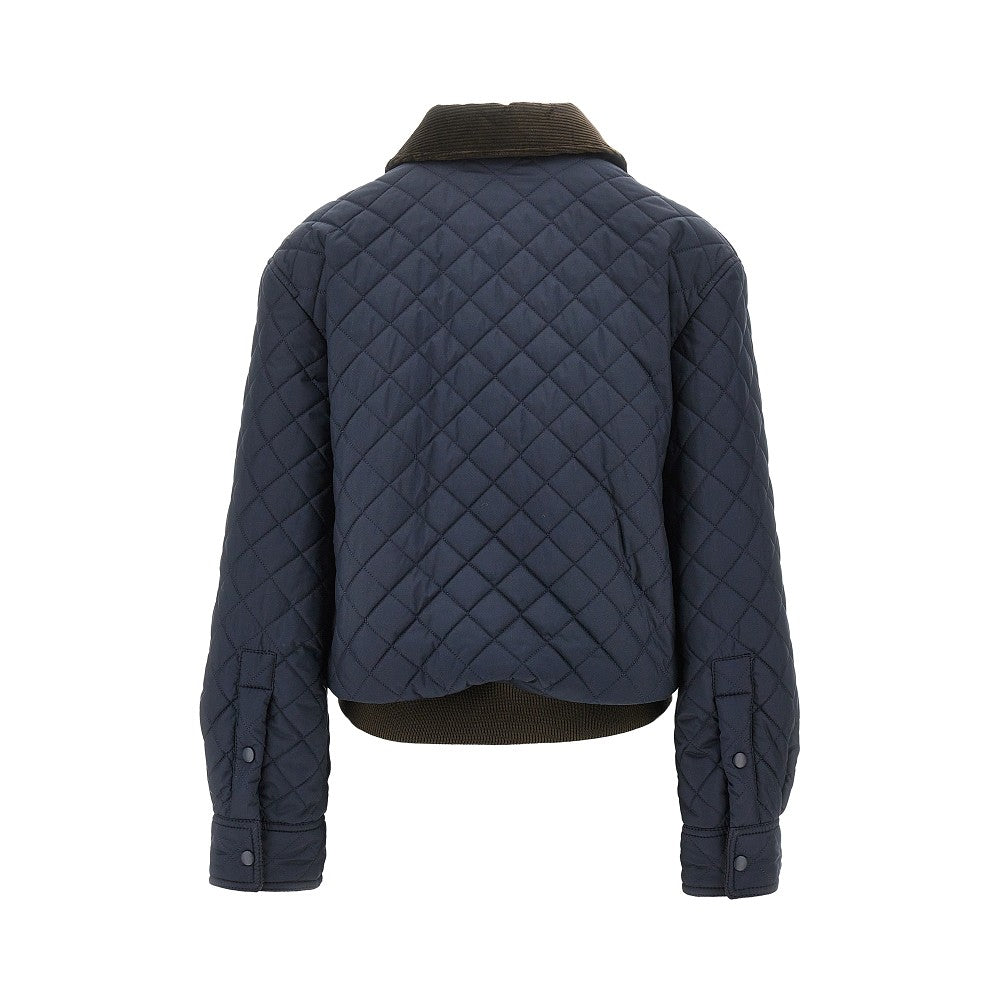 Quilted jacket with leather pocket