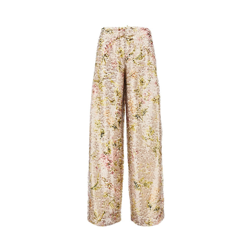 Pantalone in paillettes con stampa floreale