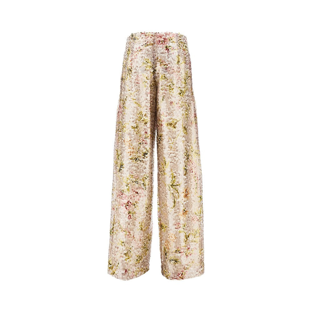 Pantalone in paillettes con stampa floreale