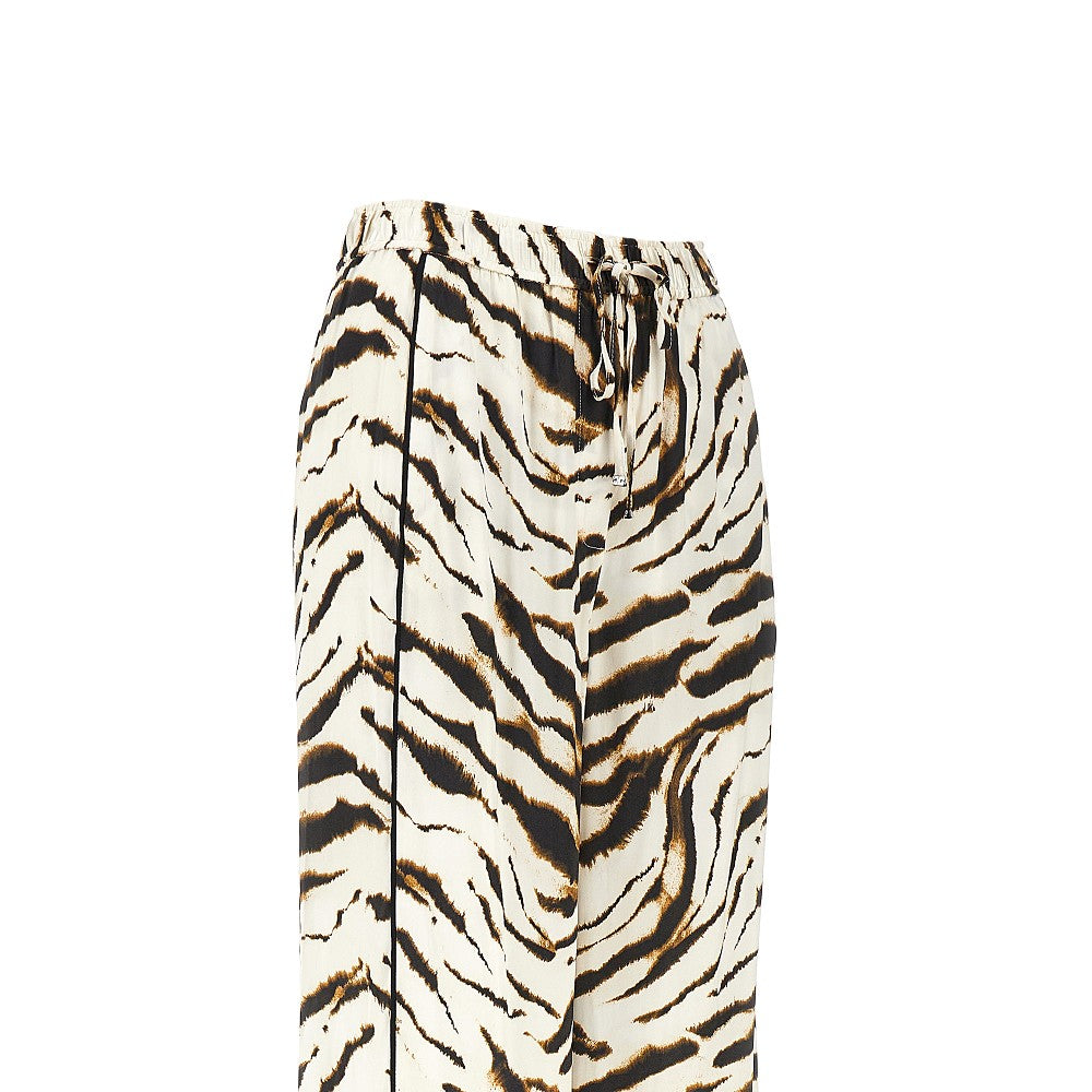 Satin pants with zebra-striped print