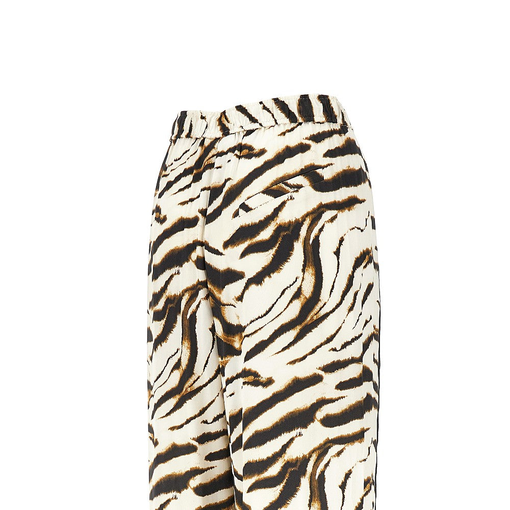 Satin pants with zebra-striped print