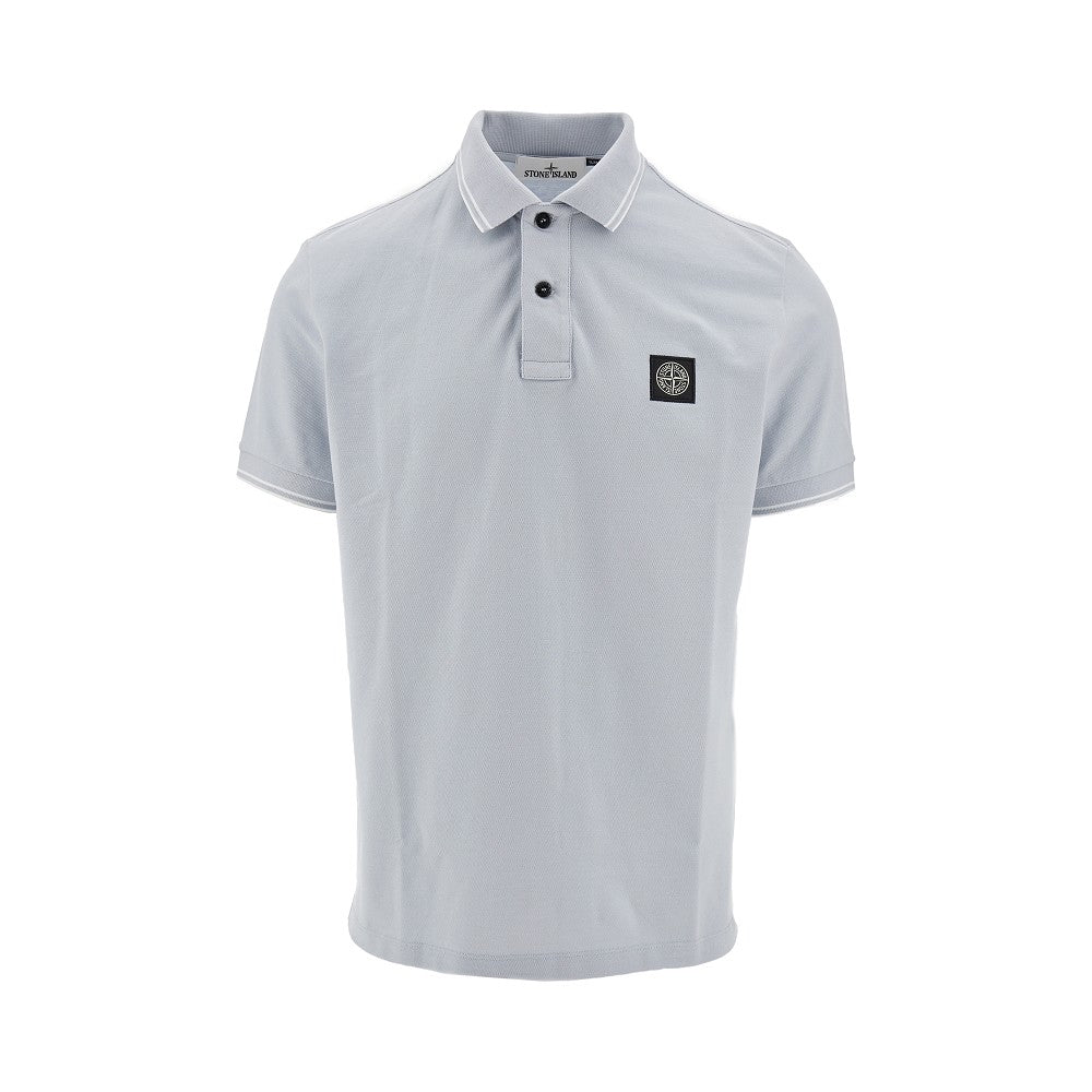 Polo in piquet stretch con patch logo