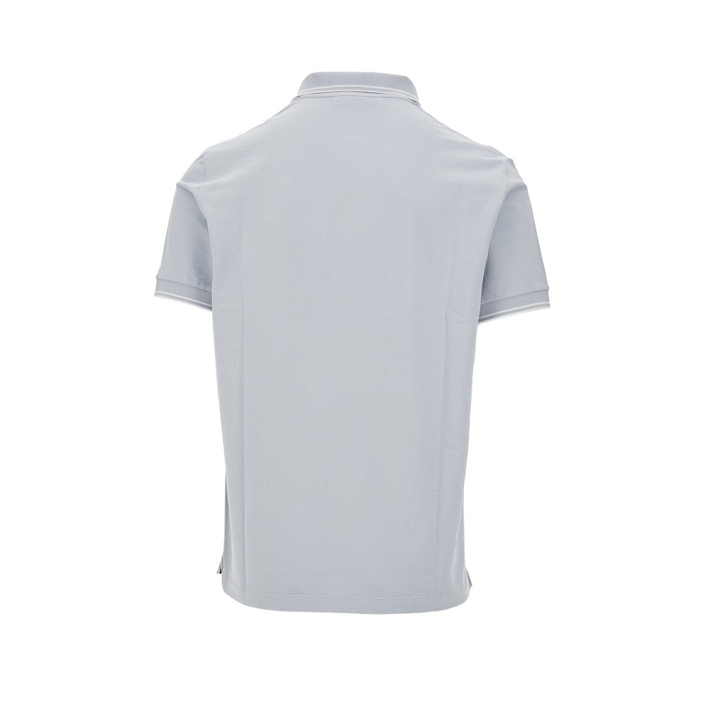 Polo in piquet stretch con patch logo