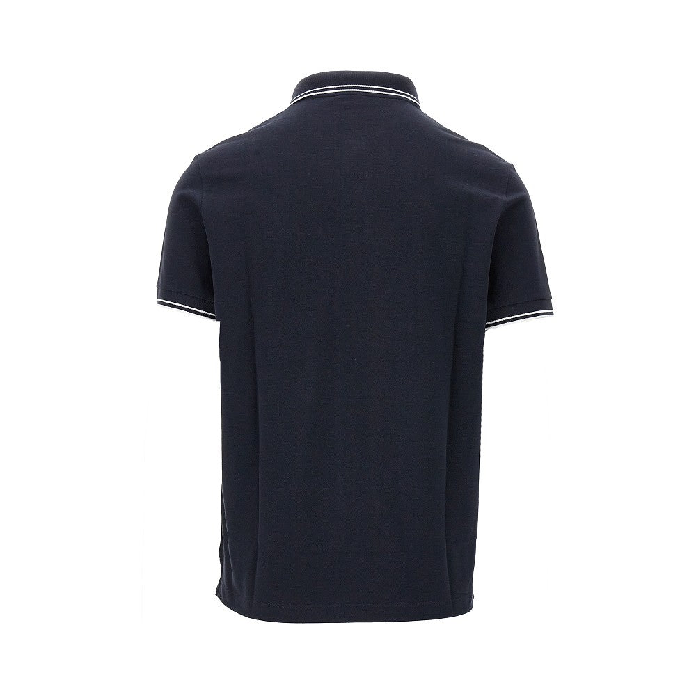 Polo in piquet stretch con patch logo