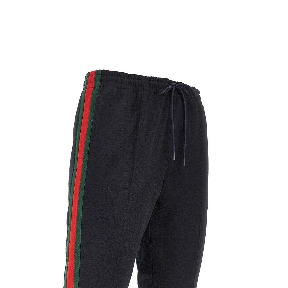 Track pants in jersey tecnico con bande Web