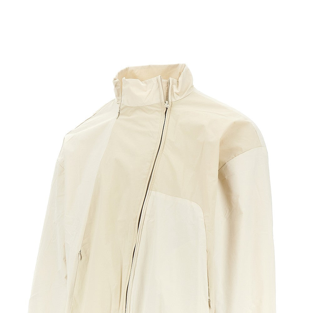 Nylon blouson jacket with curved zip