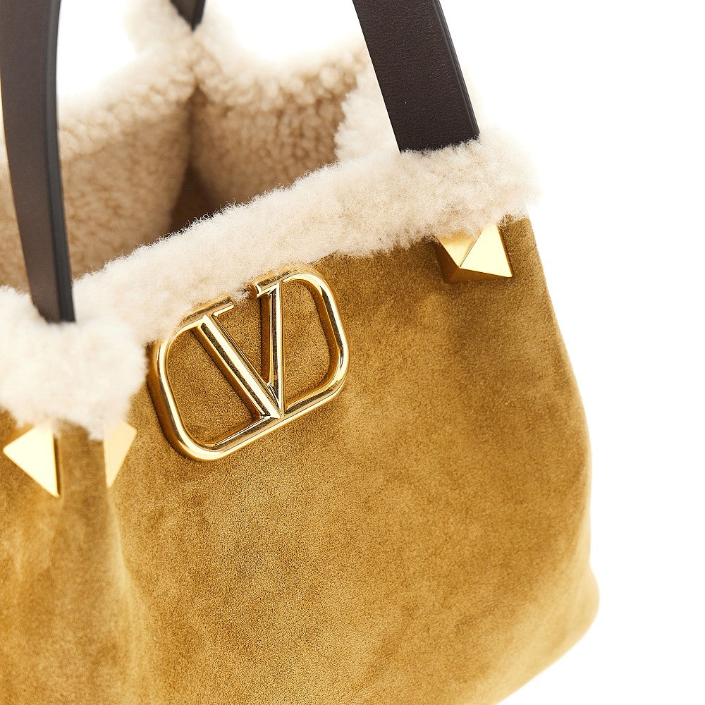 Borsa in pelle scamosciata e montone