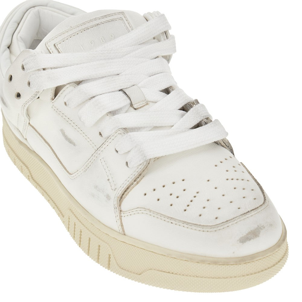 Sneakers in pelle con effetto sporco